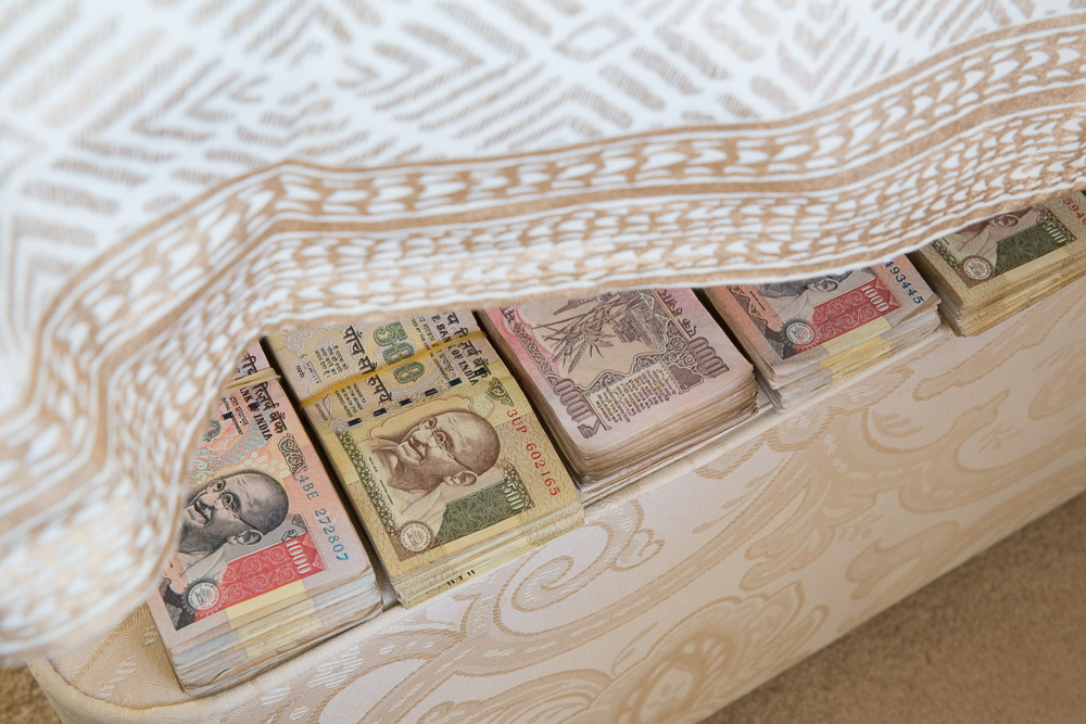 Indian rupee banknotes under the mattress