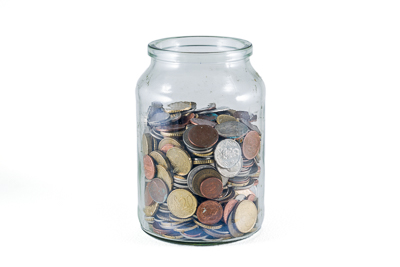 foreign coins in a jar
