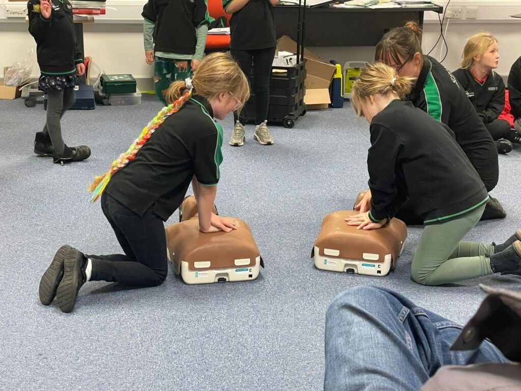 Children learning first aid at St John Ambulance Cymru