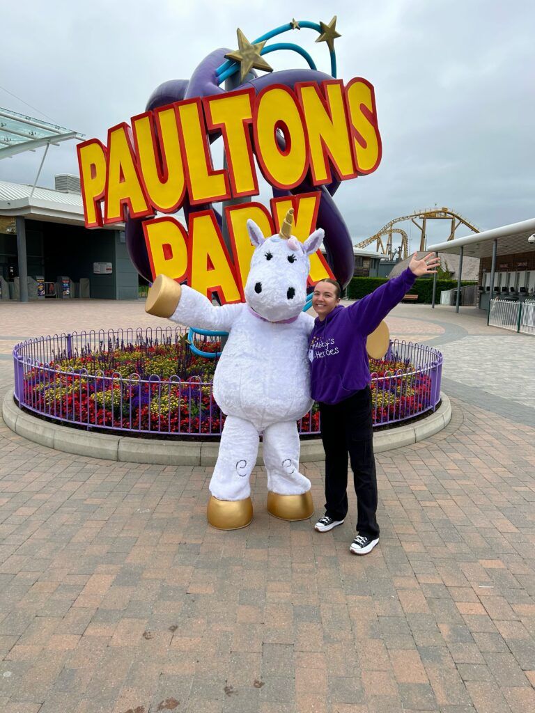 Abby's Heroes mascot and volunteer at a theme park