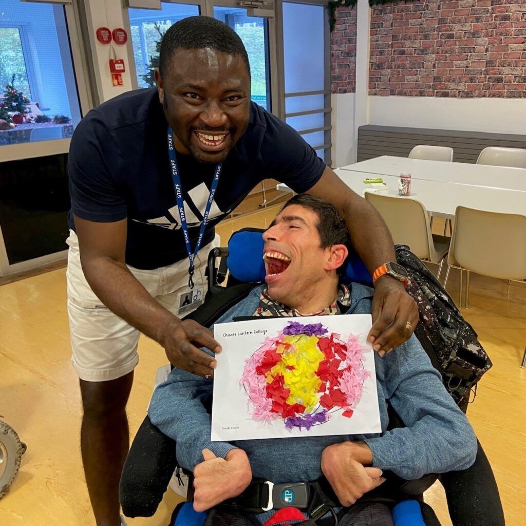 Image of volunteer with a young person at Dame Hannahs