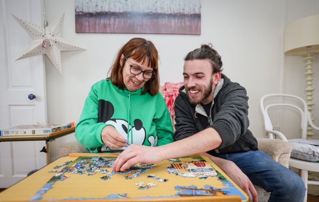 Volunteer completing a puzzle