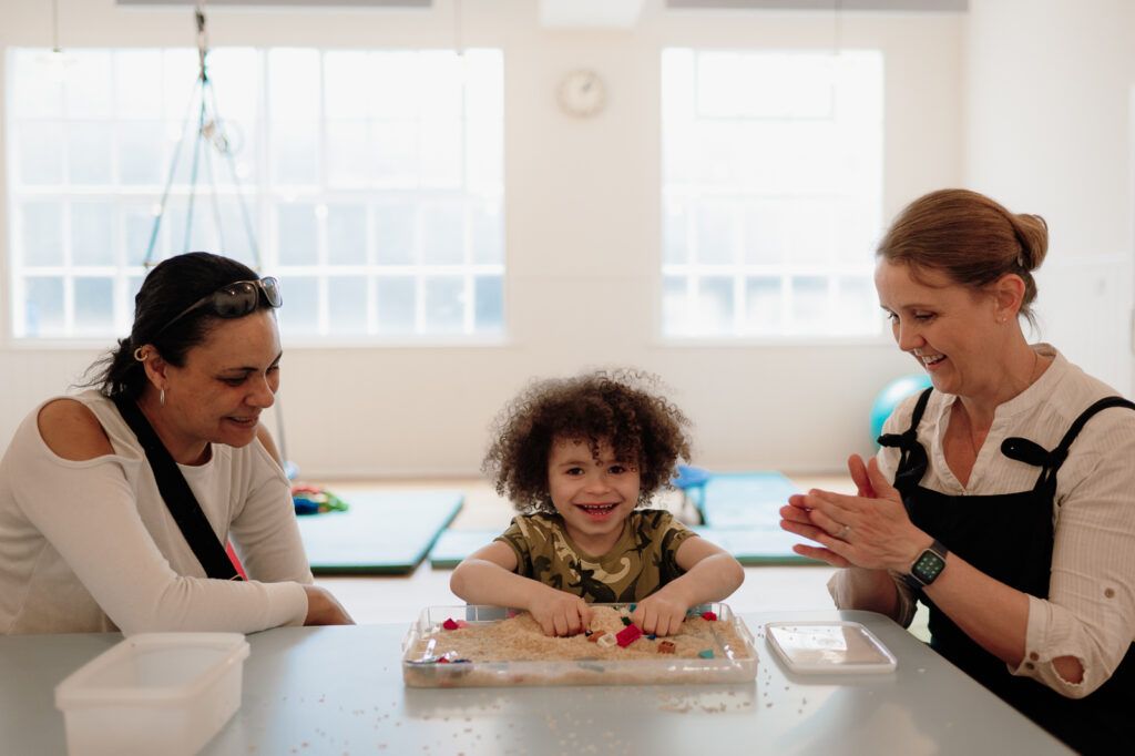 Health Care professionals supporting a young child with their additional needs