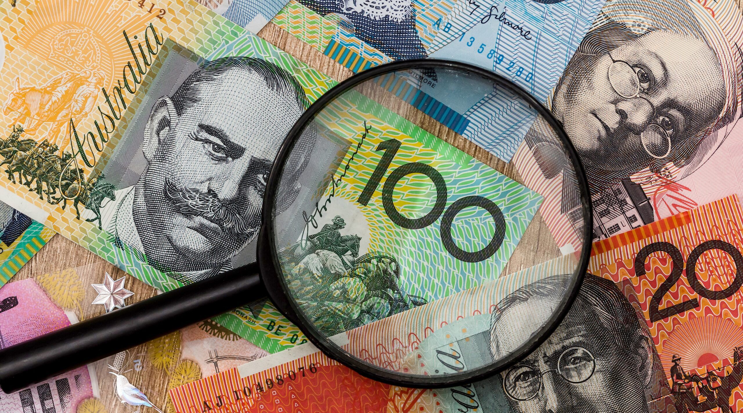Different,Australian,Banknotes,Bills,Under,Magnifying,Glass.,Aussie,Currency.,Finance