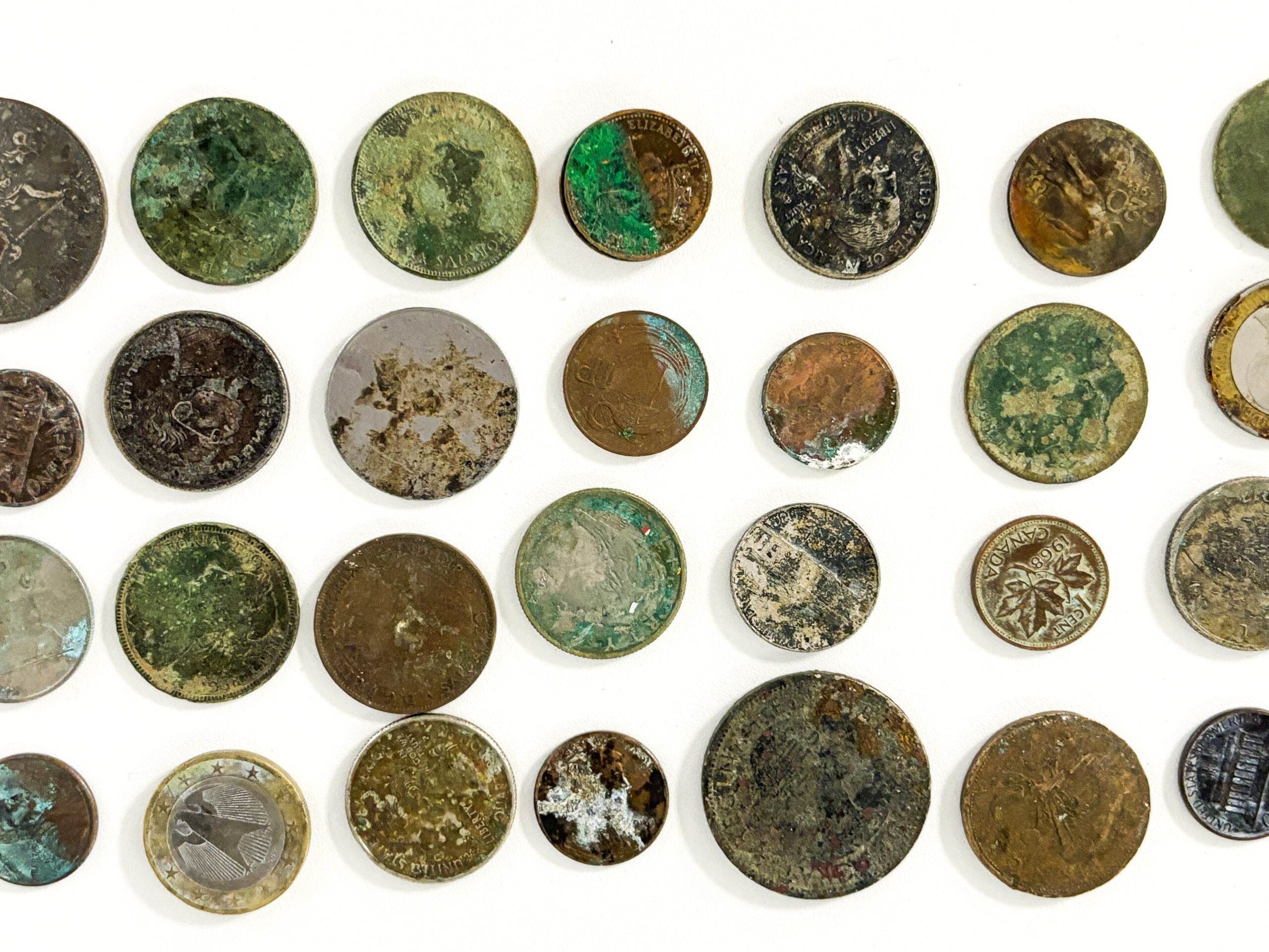 damaged coins all lined up in rows